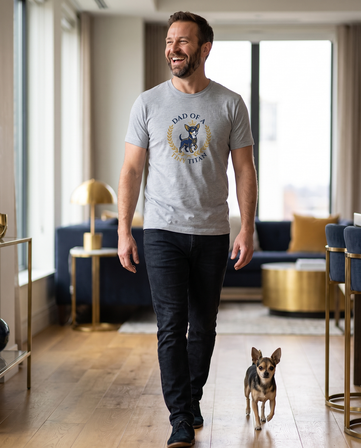 Man wearing the Dad of a Tiny Titan tee with his chihuahua