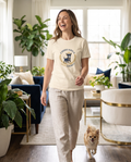 Woman wearing the Chihuahua Mom Energy t-shirt at home with her chihuahua