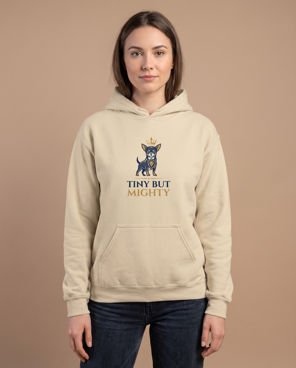 Woman wearing the Tiny But Mighty sand hoodie, front view studio shot