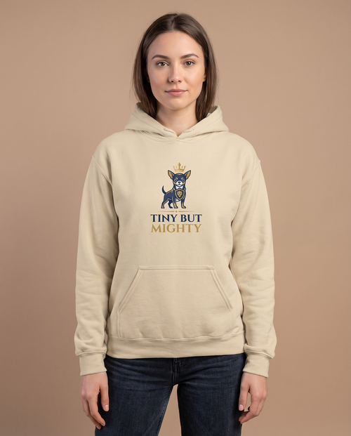 Woman wearing the Tiny But Mighty sand hoodie, front view studio shot